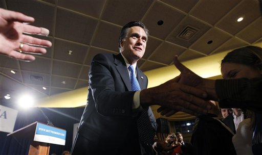 Republican presidential candidate, former Massachusetts Gov. Mitt Romney, greets supporters at his caucus night rally in Des Moines, Iowa, Tuesday.