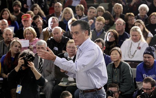 Mitt Romney campaigns during a town hall-style meeting in Manchester, N.H., on Wednesday. In Iowa, the biggest PAC player was Romney's allegedly independent Restore Our Future PAC.