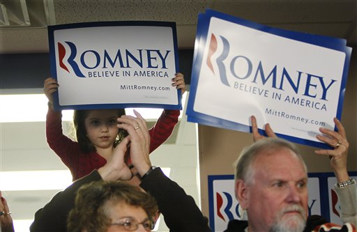 Supporters of Republican presidential candidate, former Massachusetts Gov. Mitt Romney listen during a campaign stop, Saturday, Dec. 31, 2011, in Le Mars, Iowa. (AP Photo/Eric Gay)