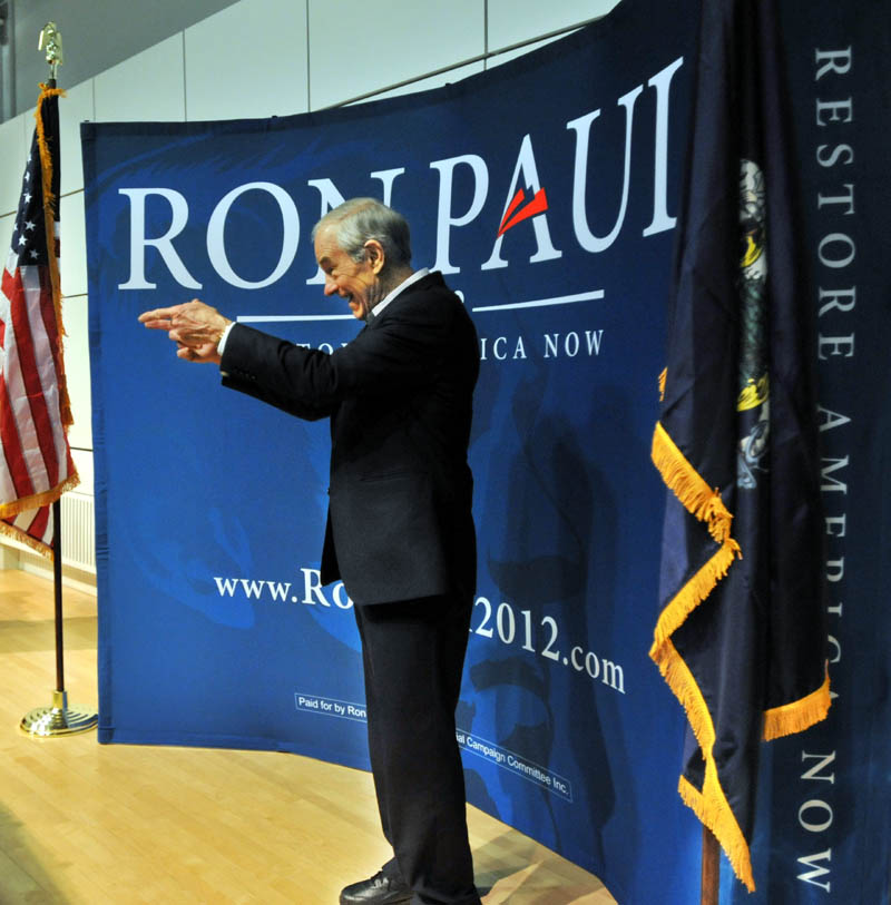 Republican Party presidential hopeful Ron Paul greets supporters after speaking at the Ostrove Auditorium at Colby College on Friday.