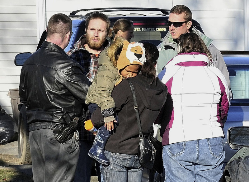 DiPietro, second from left, is questioned by police on the day after he reported the little girl missing.