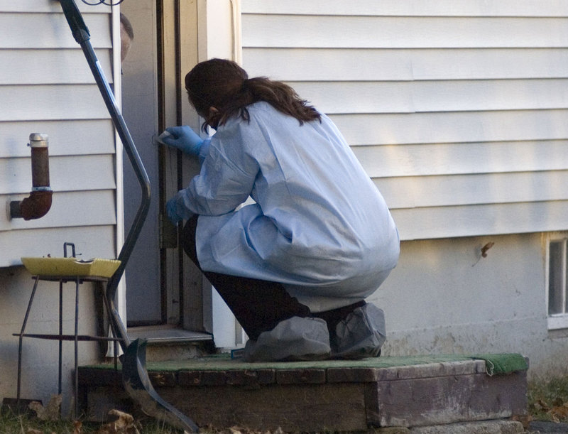 On Dec. 20, a member of the Maine State Police reconstruction team takes samples from the Violette Avenue home where Ayla last was seen.