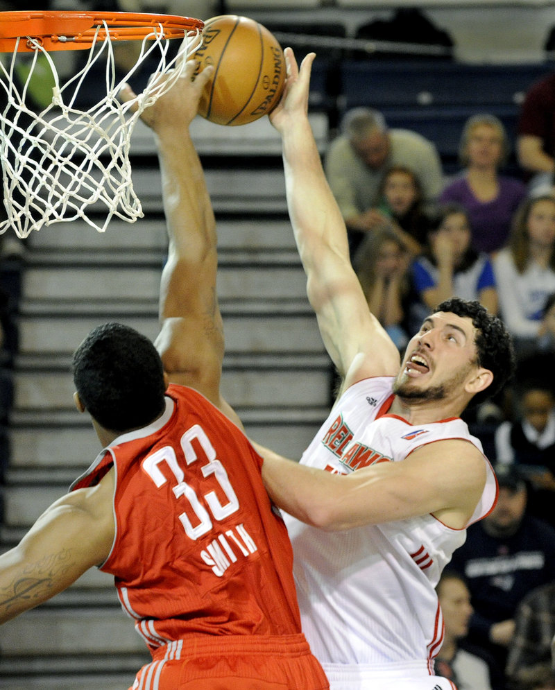 Dominic Calegari of the Maine Red Claws gets his shot blocked by Greg Smith of Rio Grande Valley during Saturday’s D-League game at the Portland Expo. The Vipers rolled past Maine, 101-83.