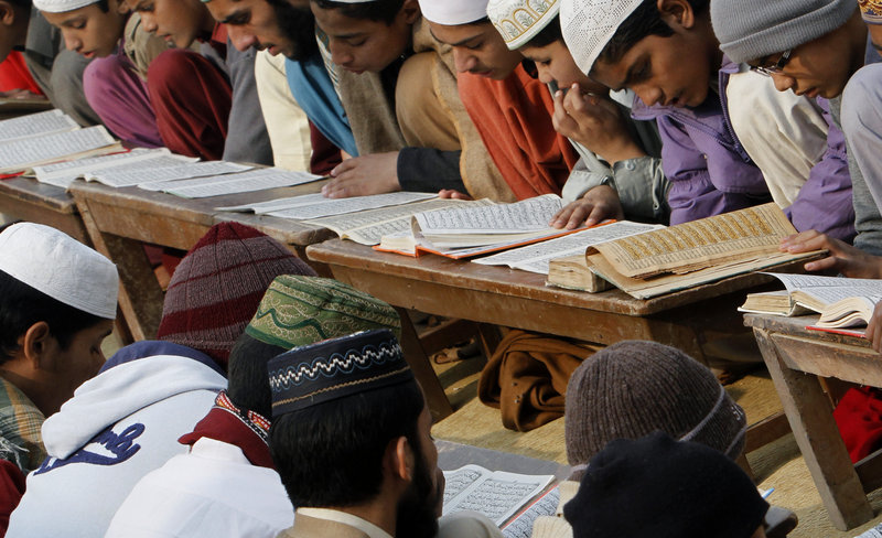 Pakistani religious students attend their daily class at an Islamic seminary in Okara, Pakistan, where a course is offered to the public by a cleric aiming to counter extremism.