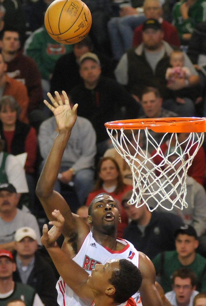 Anthony Kent watches his shot go in the basket Sunday for the Red Claws, who at one stretch went more than nine minutes without a point in their loss.