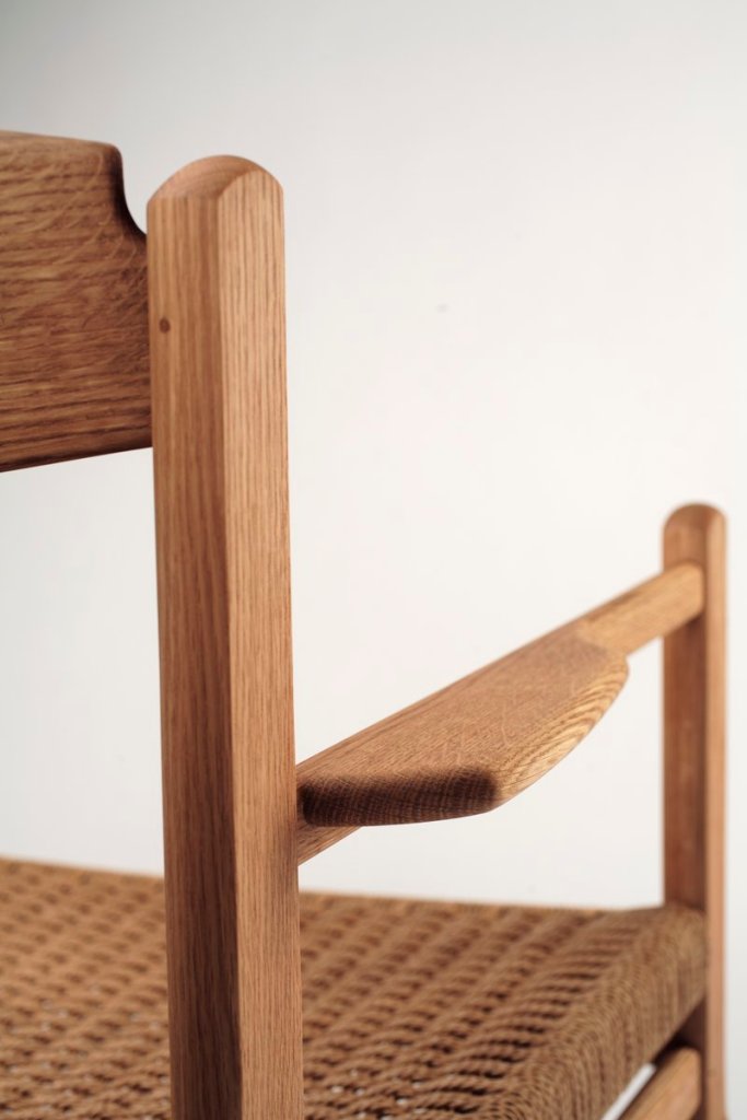 A close-up of Peter Turner’s Arrow chair shows the flared armrest.
