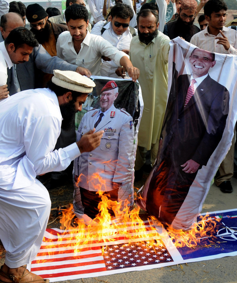 Supporters of the Pakistani religious party Jamatud Dawa burn a representation of the U.S. flag and posters of President Obama and a NATO general during a protest to condemn NATO strikes on Pakistani posts in November.