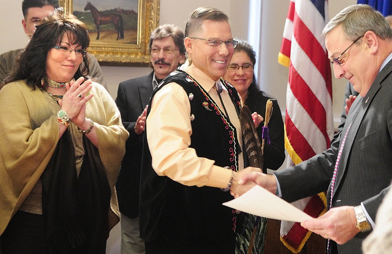 David Slagger, accompanied by his wife, Priscilla, left, greets Gov. Paul LePage after the Kenduskeag lawmaker was sworn in at the State House as Maine’s first Maliseet Indian legislator. Two of Maine’s four tribes – the Penobscots and Passamaquoddies – had already been represented in the Legislature. Now, with Slagger standing for the Houlton Band of Maliseets, only the Micmacs remain unrepresented.