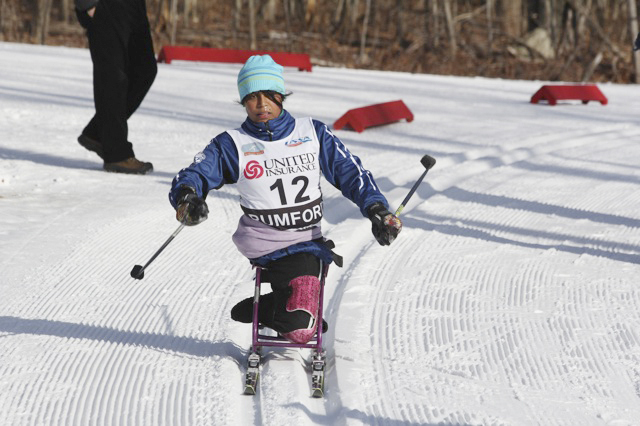 Christina Kouros of Cape Elizabeth handles a turn Wednesday on the way to a silver medal in the adaptive sit-ski competition at the U.S. cross country ski championships.