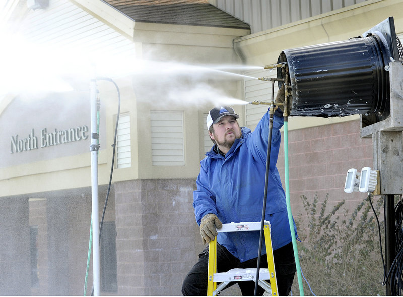Marcus Corey, event organizer for Biddeford Big Air & Rail Jam, adjusts a snow gun that will make snow for the ski and snowboard event Jan. 13 at the New Life Church in Biddeford.