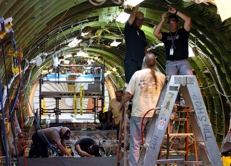 Boeing employees do modification work on a KC-767 tanker in 2004 in Wichita, Kan. Boeing Co. plans to close the massive defense plant in Wichita before the end of 2013.