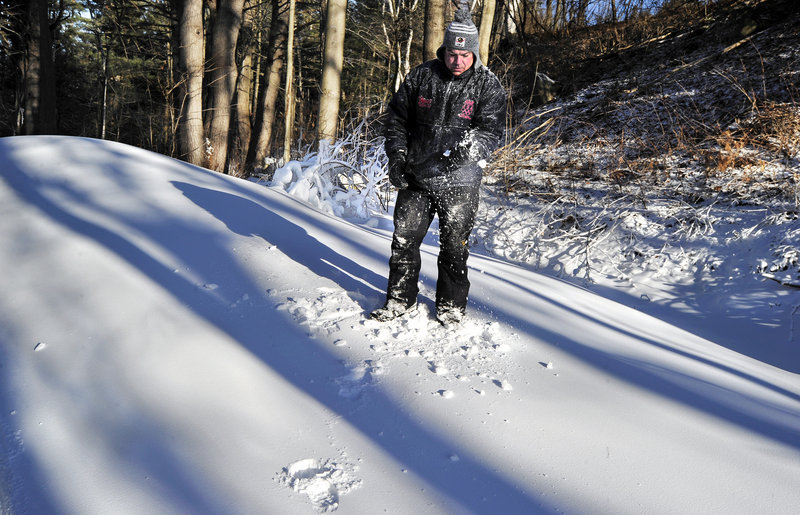 Matt Sabasteanski, the outdoor recreation director at Pineland Farms, checks the quality of the man-made snow used to cover the facility’s cross country trails.