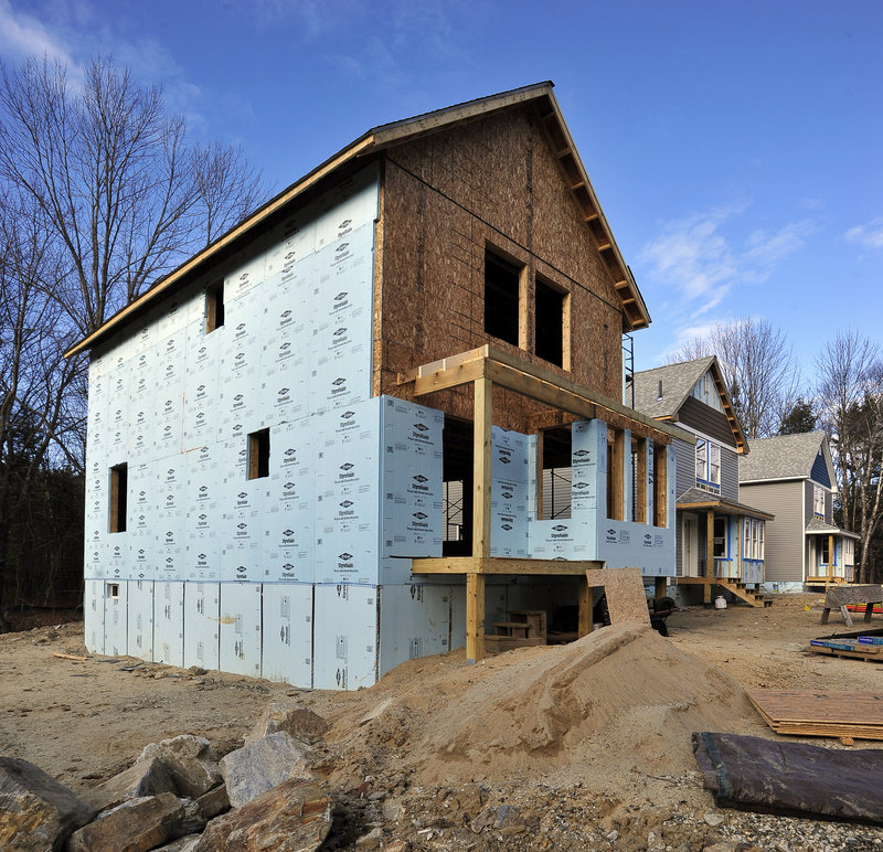 Styrofoam insulation panels stand out on one of three homes being built as part of the South Street Freeport Project.