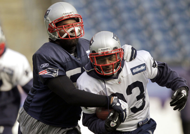 Patriots middle linebacker Jerod Mayo tries to dislodge the football from running back Kevin Faulk during a drill Thursday at team practice in Foxborough, Mass. Mayo has had more than 100 tackles in each of his four NFL seasons, the first Patriot to do that, and led the team each year.