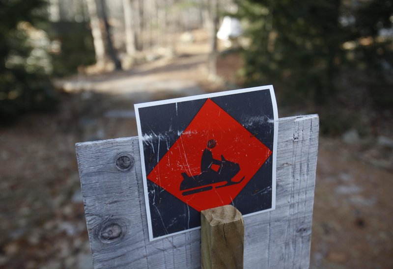 A snowmobile trail sign in Bridgton marks a snow-less trail. As of Thursday, only 19 percent of the nation was covered in snow, less than half the average over the past five years.