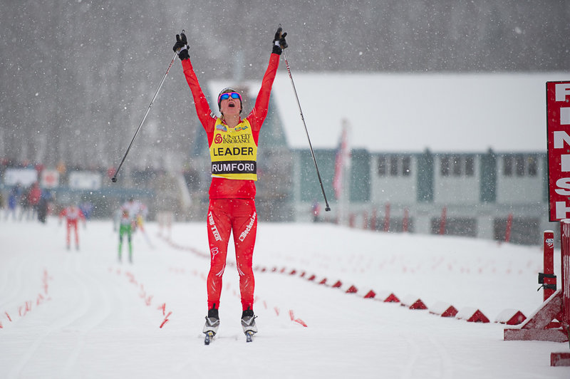 Jessie Diggins of Minnesota celebrates as she crosses the finish line to win the women’s 20K classical event Friday at the U.S. Cross Country Championships in Rumford, claiming her third national title in three races this week.
