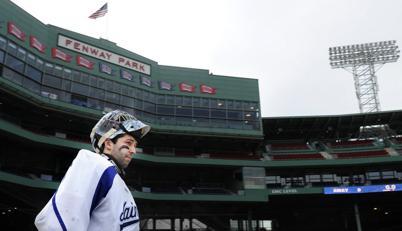Josh Seeley, one of the University of Maine goalies, steps onto the field at Fenway Park. Not for baseball, but for hockey practice for tonight’s game against New Hampshire.