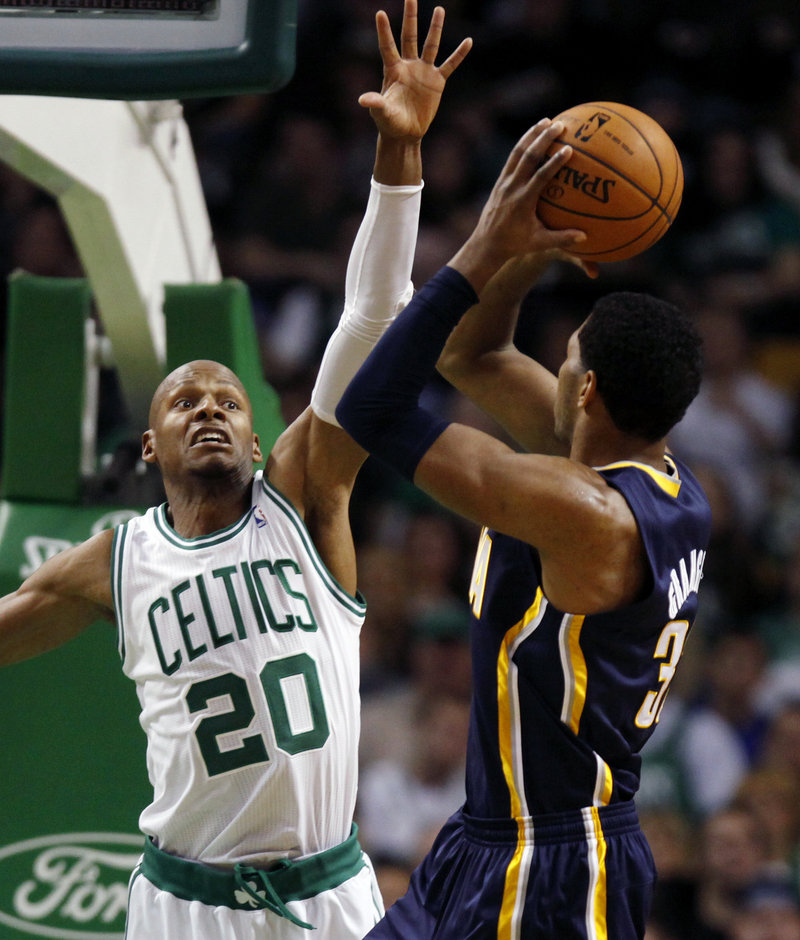Danny Granger of the Indiana Pacers looks for room to shoot over Ray Allen of the Boston Celtics during the third period of the Pacers’ 87-74 victory Friday night.