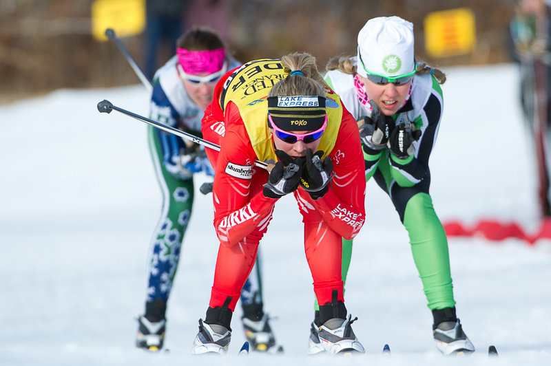 Jessie Diggins heads toward the finish line ahead of Ida Sargent, right, and Sophie Caldwell during a women’s sprint semifinal Sunday at Black Mountain in Rumford. Diggins went on to earn her fourth national title of the week with a second-place finish in the final.
