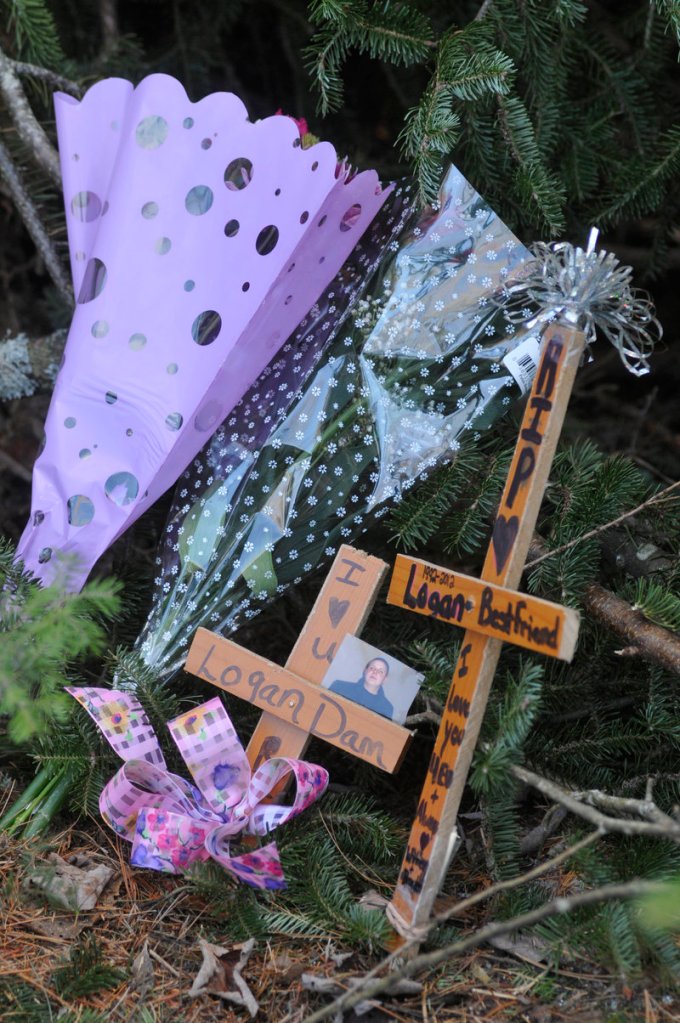 Two crosses left by friends at the scene of the crash on Route 219 in West Paris memorialize Logan Dam, 19, of Norway, who also was killed.