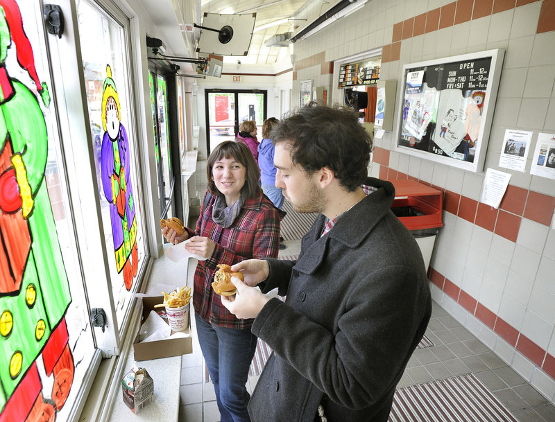 Richele Grenier of Old Orchard Beach and Sam Chattow of South Portland enjoy burgers at Rapid Ray’s in Saco.