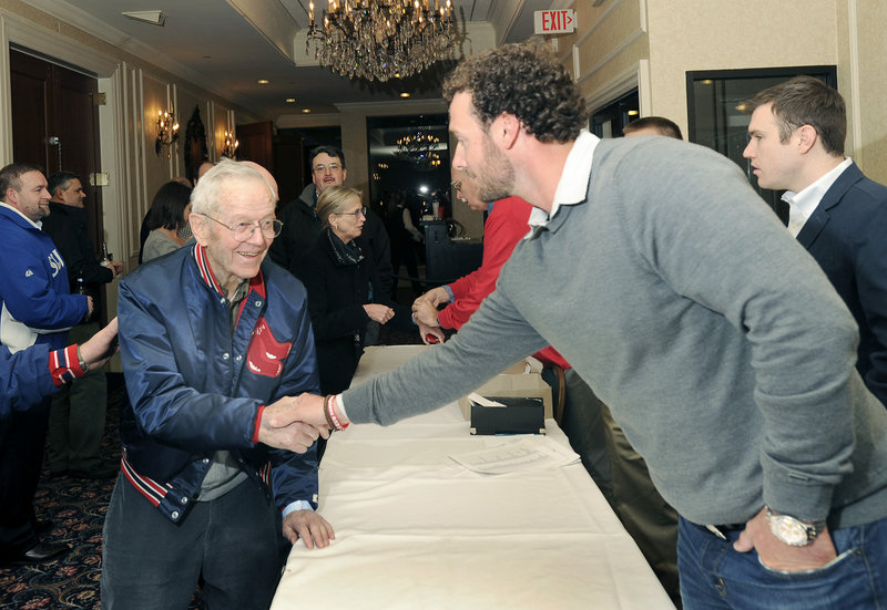 Phillip Leach of Hallowell, left, a Red Sox fan since the 1930s, meets catcher Jarrod Saltalamacchia on Friday at the Portland Sea Dogs’ Hot Stove event in South Portland.