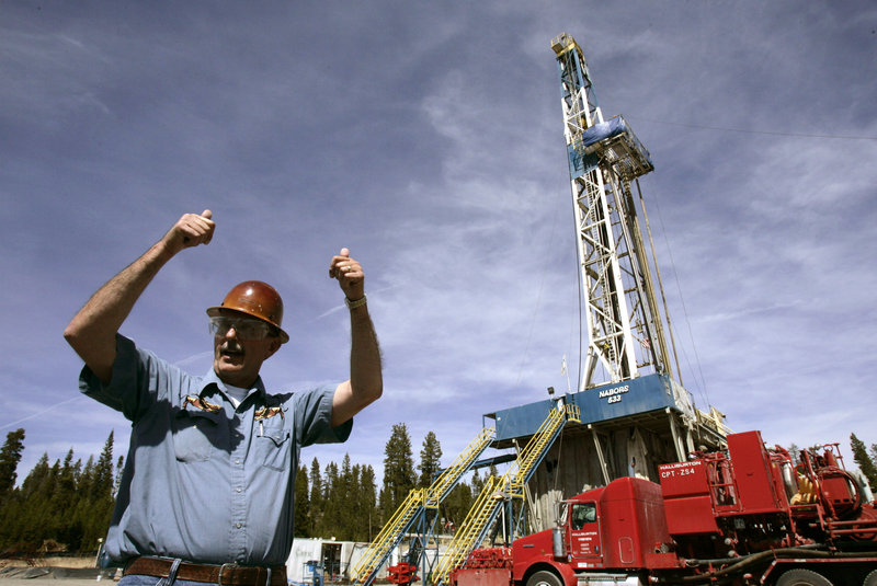 Project drilling manager Fred Wilson stands near a drilling rig at the Newberry Crater geothermal project in 2008.