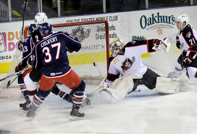 Pirates goalie Justin Pogge can’t cover the net as Cam Atkinson of the Springfield Falcons scores the first goal of Saturday’s game. Springfield beat the Pirates 4-2 at the Cumberland County Civic Center.