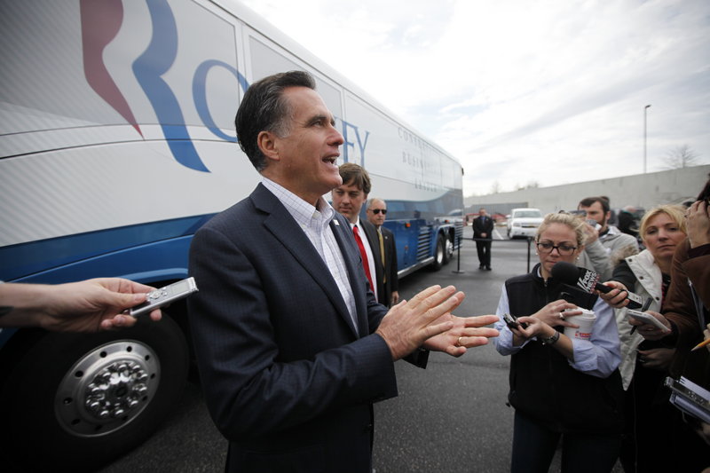 Presidential candidate Mitt Romney speaks to reporters after a campaign appearance Tuesday at the Florence Civic Center in Florence, S.C. The Republican front-runner’s rivals are pushing Romney to release his tax returns now.