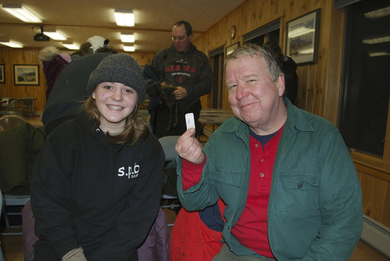 It’s almost like a golden ticket for Dave Jackson, right, and his daughter, Sarah. They traveled from Massapequa, N.Y., camped out for three nights and made summer reservations at Baxter State Park in the annual tradition that survives, even though many reservations are now made online.