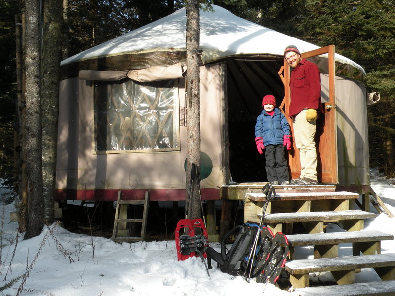 Glen Widmer and his son, Isaac, stand outside the Goose Ridge Yurt in Montville. It offers overnight stays in the wilderness without needing to travel to the deep woods.
