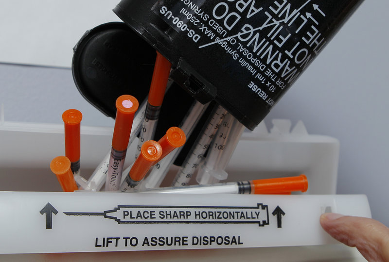 Hypodermic needles are disposed of Friday at a clinic in Portland. No federal or state money is used for needle exchange programs, and private grant money for them is running out.