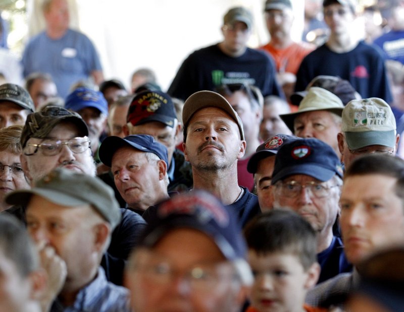 Maine residents and others listen to names being called during the lottery for moose hunting permits in 2010.