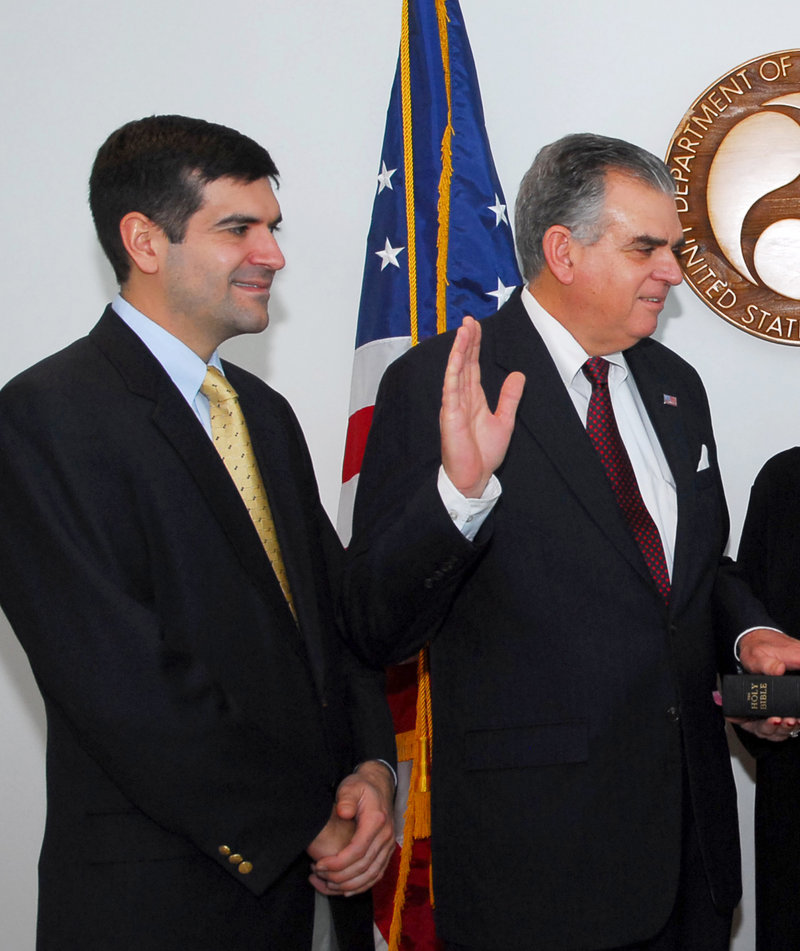 Sam LaHood, left, watches as his father, Ray, is sworn in as transportation secretary in 2009. Sam LaHood has been banned from leaving Egypt.