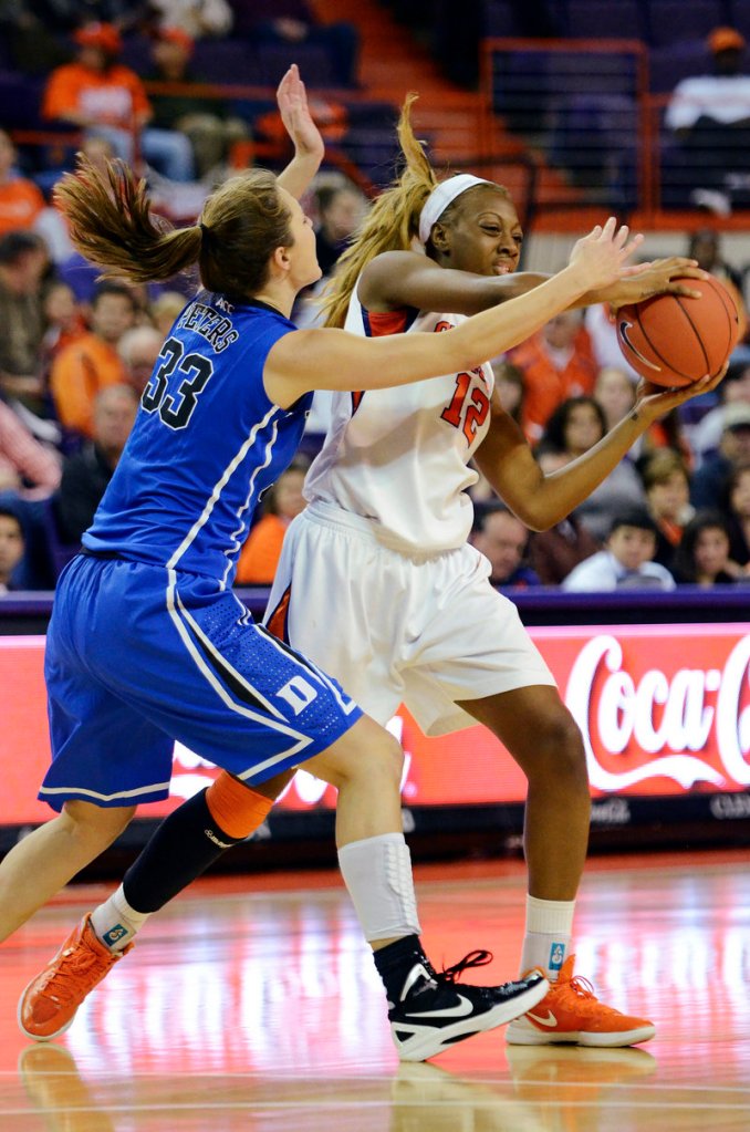 Quinyotta Pettaway of Clemson looks to pass under pressure from Haley Peters during fifth-ranked Duke’s 81-37 victory Friday night at Clemson, S.C.