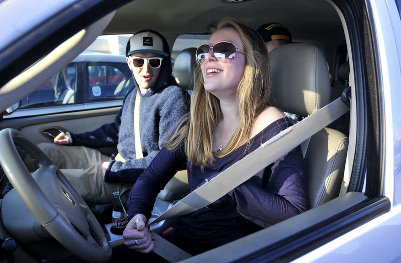 Samantha Rideout, 16, of New Gloucester buckles up as she prepares to drive off with her friends, including Nik Pelletier, 17, of Yarmouth, after they visited the Maine Mall in South Portland on Sunday.