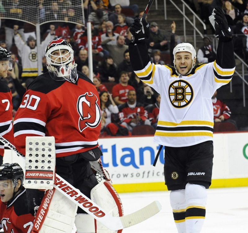 Gregory Campbell celebrates his first-period goal against Devils goaltender Martin Brodeur Wednesday night in Newark, N.J. Campbell’s goal started a string of six straight goals for the Bruins, who crushed the Devils, 6-1.