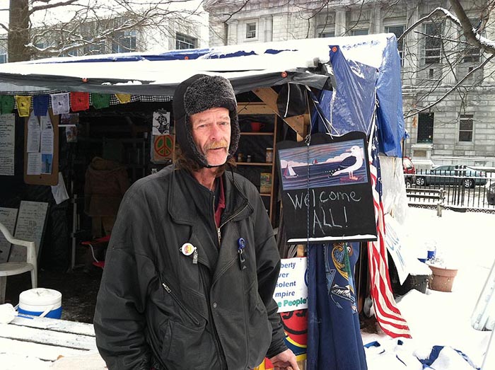 Harry Brown, one of the Occupy Maine demonstrators who has been camping out in Lincoln Park to protest economic inequities, expresses disappointment today in a judge's decision that the demonstrators' extended use of the park interferes with others' ability to use it.