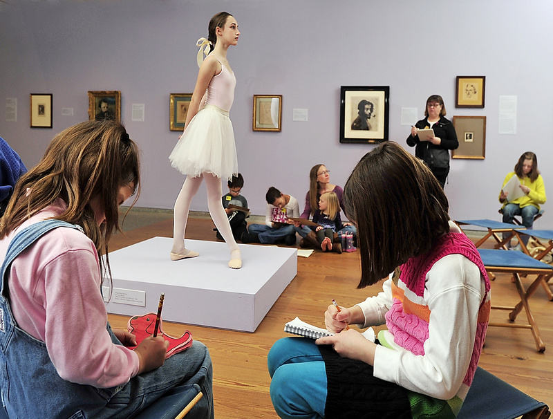 Lucy Denton, 13, a member of the Maine State Ballet for the past eight years, poses like one of the Degas bronze sculptures for “Drawing Dancers Like Degas” at the Portland Museum of Art on Thursday.