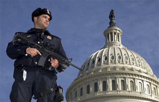 Capitol Police officer Angel Morales stands on guard on the West side of the Capitol in Washington Friday, Feb. 17, 2012. A 29-year-old Moroccan man was arrested Friday in an FBI sting operation near the U.S. Capitol while planning to detonate what police say he thought were live explosives. (AP Photo/Manuel Balce Ceneta)