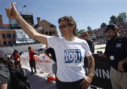 Television host Dr. Mehmet Oz greets runners at the finish line of the 32nd annual Bolder Boulder 10K road race in Boulder, Colo., in 2010. Oz says that “transformation nation,” a health effort that has attracted 1 million participants so far, “is one of the most rewarding experiences of my life.”