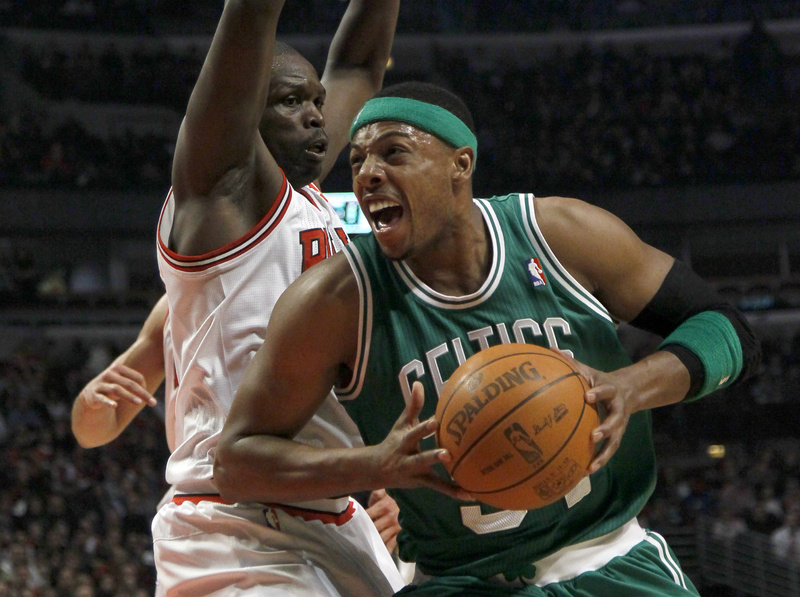 Celtics forward Paul Pierce drives past Bulls forward Luol Deng during the first half of Thursday's game in Chicago.