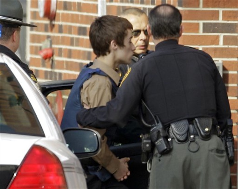 T.J. Lane, a suspect in Monday's shooting of five students at Chardon High School is taken into juvenile court in Chardon, Ohio on Tuesday, Feb. 28, 2012. (AP Photo/Mark Duncan)