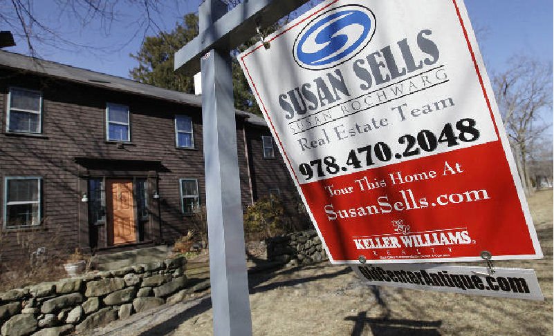 A home is for sale in North Andover, Mass. Sales of previously occupied U.S. homes rose in January to the highest pace in nearly two years, a hopeful sign ahead of the spring-buying season. (AP Photo)