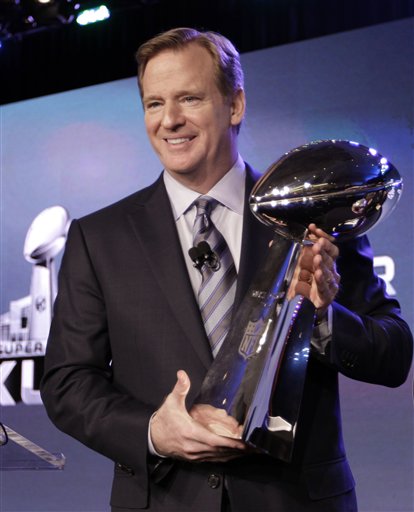 NFL Commissioner Roger Goodell poses with the Vince Lombardi Trophy after a news conference Friday, Feb. 3, 2012, in Indianapolis. (AP Photo/David J. Phillip)