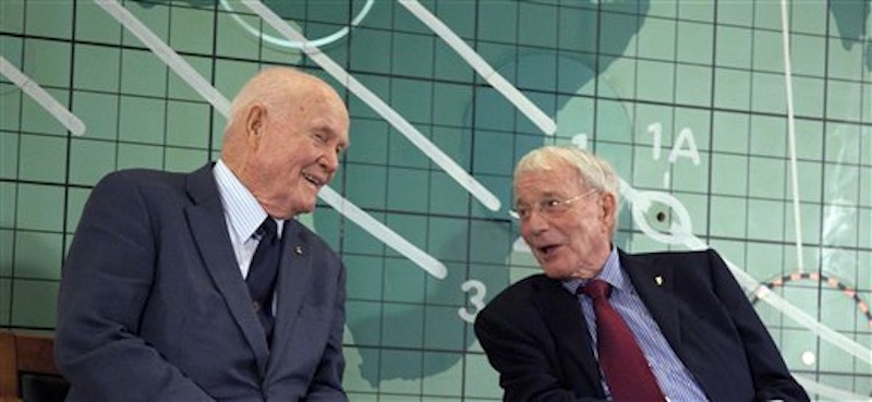 Former Sen. John Glenn, left, and Scott Carpenter, right, speak at the Kennedy Space Center, Friday, Feb. 17, 2012 in Cape Canaveral, Fla. Three days before the 50th anniversary of his historic flight, the first American to orbit the Earth addressed employees at Kennedy Space Center. (AP Photo/Michael Brown)