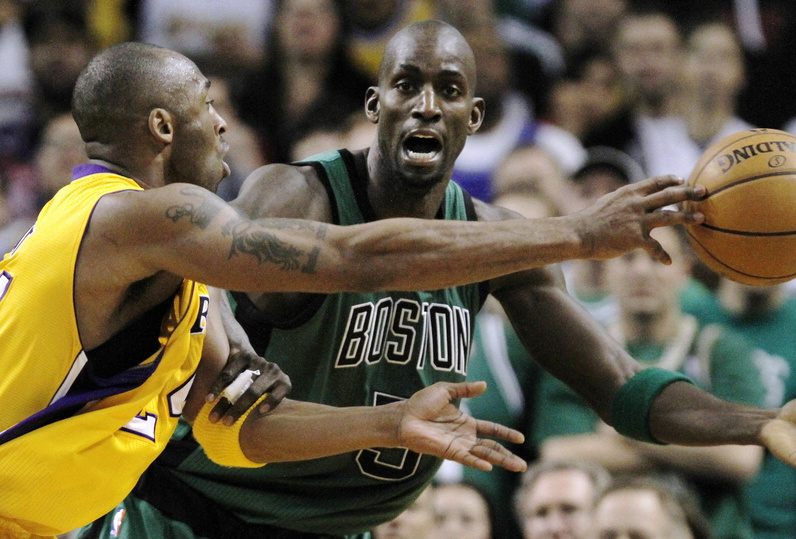 Celtics forward Kevin Garnett defends Lakers guard Kobe Bryant on a drive to the basket during the second quarter Thursday night in Boston. The Lakers won, 88-87.
