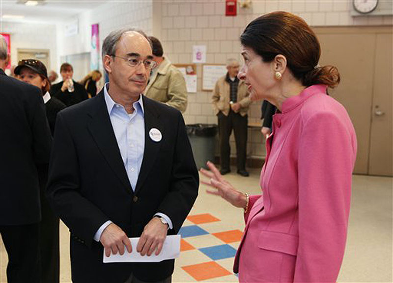 Sen. Olympia Snowe, R-Maine speaks with state Treasurer Bruce Poliquin during the Kennebec County Super Caucus in Augusta on Saturday. 2012. Snowe is facing a primary challenger for the first time in her political career. (AP Photo/Joel Page)