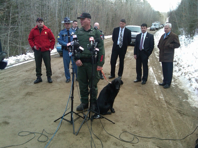Game Warden Norman Lewis, with other officials, answers questions at a news conference on Wednesday in Newburgh, where authorities found the body of missing firefighter Jerry Perdomo. Daniel Porter has been charged in the killing.