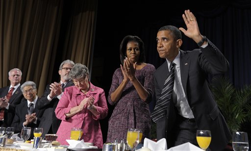 President Barack Obama acknowledges applause after speaking today at the National Prayer Breakfast in Washington.